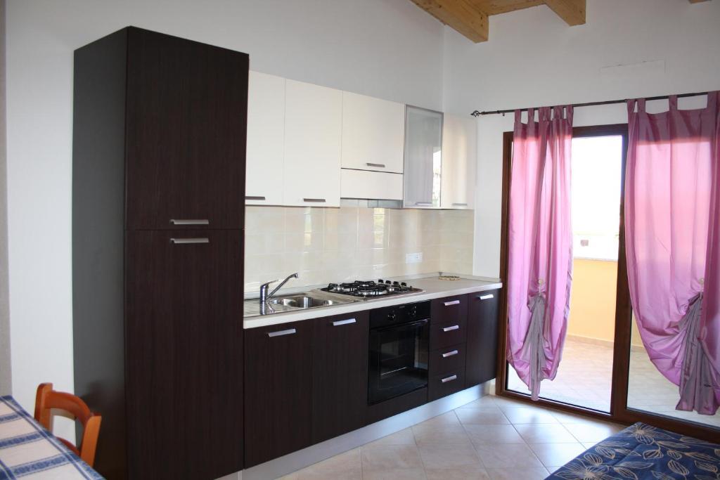 Appartamenti Ideal Isola Rossa Bilik gambar